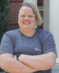 Tawn Christians, a White person in a gray shirt